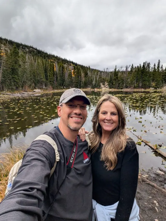 Brad and Stacey Shannon beside a mountain lake.